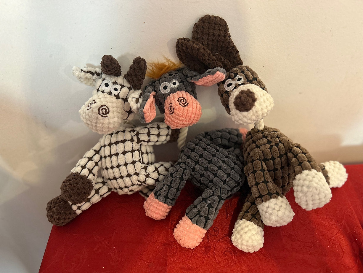 Soft toy with rope and squeaker